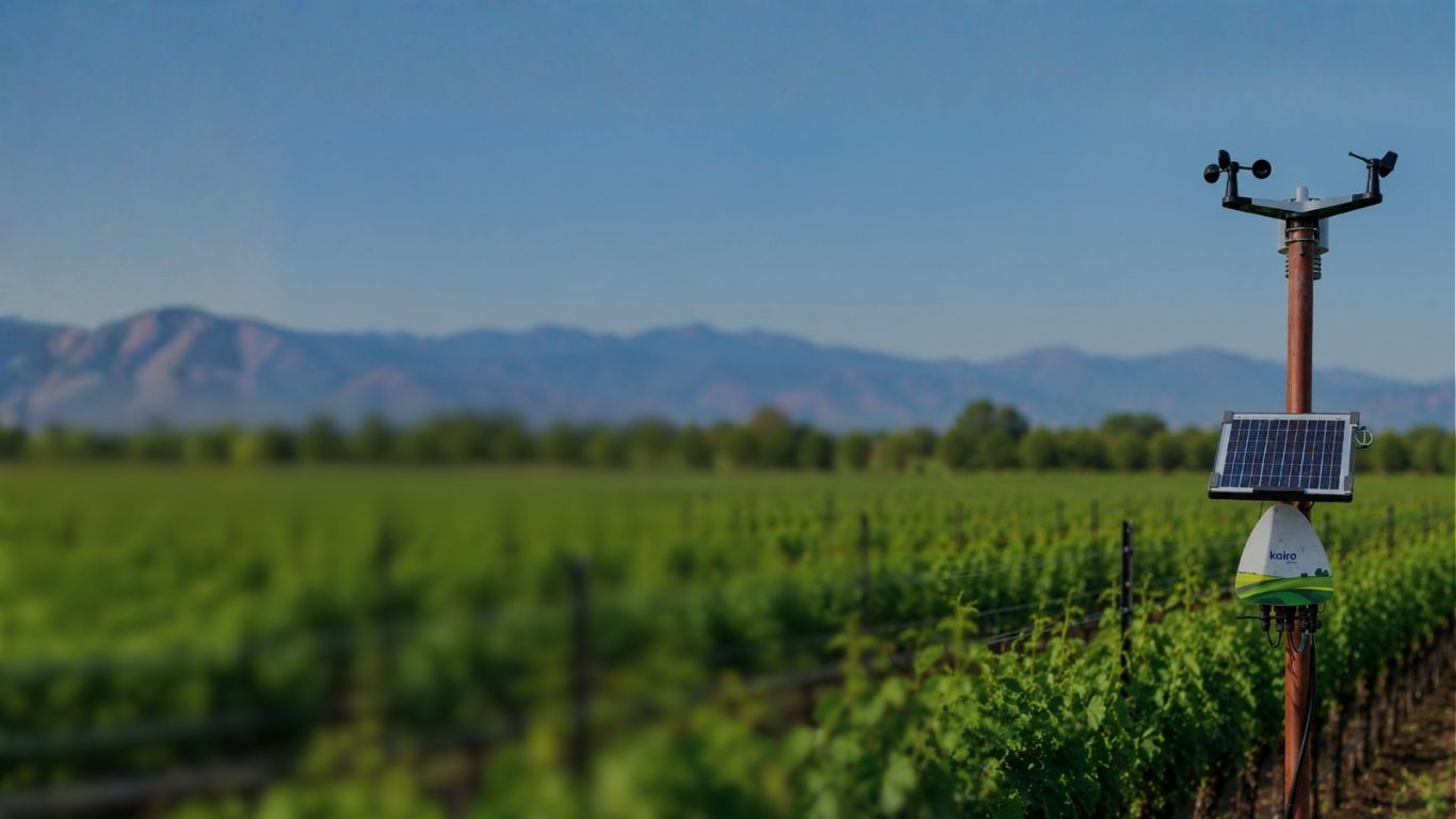 Hyperlocal smart farming field background with Fyllo precision agricultural IoT device monitoring soil and weather